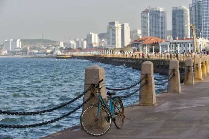 Framed Print : Bicycle at waterfront with Yantai city skyline, Shandong Province, China