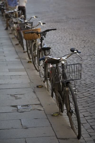 Bicycles parked at curb, Ferrara, Emilia Romagne, Italy