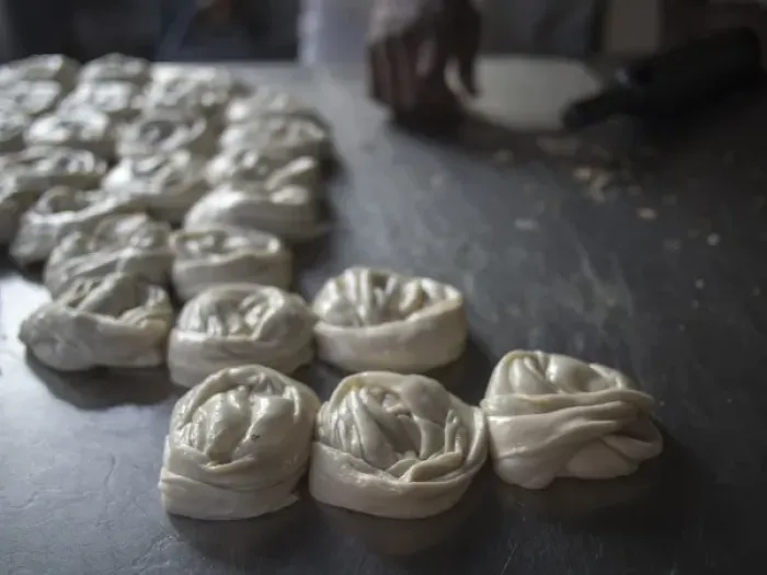 Framed Print : Bits of dougH are rolled into mounds Tto be cooked in Bangalore, Karnataka, India
