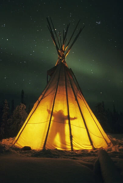 Blachford Lake, Great Slave Lake area, near Yellowknife, man in teepee at night with