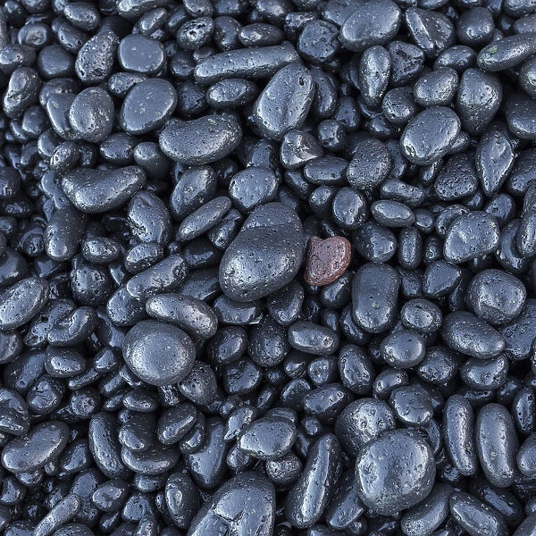 Black pebble rocks on Miloli i Beach, Big Island, Hawaii