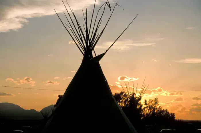 Framed Print : Blackfeet tepees made from canvas stretched over tipi poles at sunset in Browning Montana