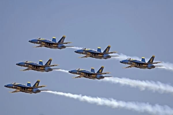 Blue Angles F  /  A 18 C  /  D Hornets flying formation at Oshkosh, Wisconsin