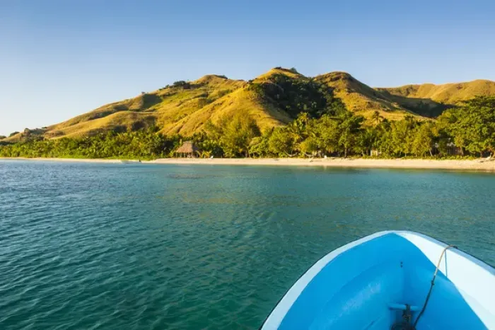 Framed Print : Blue boat cruising through the Yasawas, Fiji, South Pacific