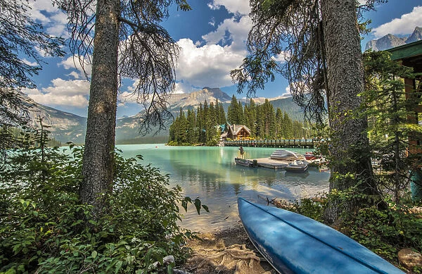 Blue canoe on shore of Emerald lake in Yoho National Park, Canada