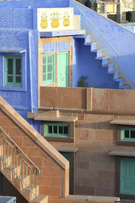 Framed Print : Blue City, Jodhpur, India. Blue apartment with a teal, green door, and painted flower pots Framed Print : Blue City, Jodhpur, India. Blue apartment with a teal, green door, and painted flower pots