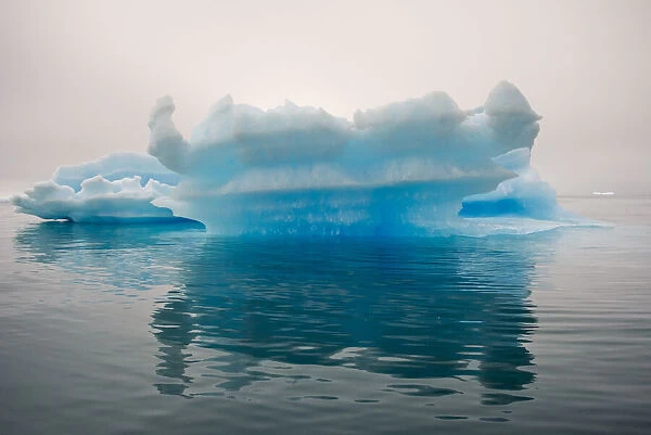 Blue iceberg in the fjord of Narsarsuaq, Greenland