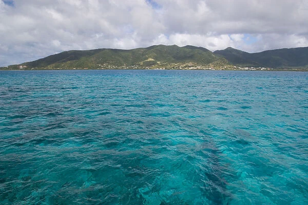 The blue waters of the Caribbean Sea over a coral reef near the island of Antigua