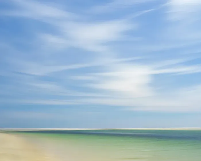 Framed Print : Blur of beach, clouds, and sky