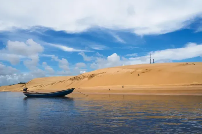 Framed Print : Boat and sand dune along the Preguicas River, Maranhao State, Brazil Framed Print : Boat and sand dune along the Preguicas River, Maranhao State, Brazil