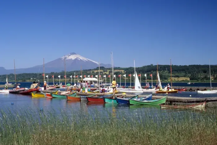 Framed Print : Boats docked at a marina with Villarica volcano in Villarica, Chile