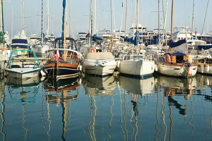 Framed Print : Boats and reflections in the marina area of Beaulieu sur Mer. on the coastline in Framed Print : Boats and reflections in the marina area of Beaulieu sur Mer. on the coastline in