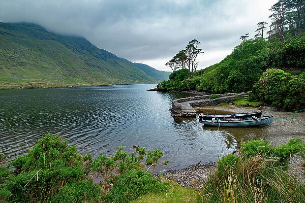 Boats wait for passengers at Doo Lough, part of a national park in County Mayo, Ireland