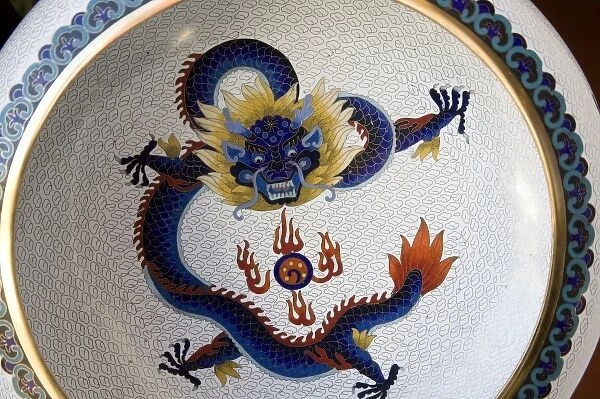 Bold dragon design on cloisonne plate displayed at factory showroom outside Beijing