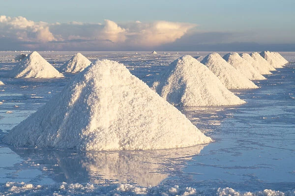 Bolivia, Uyuni, Salar de Uyuni. Cones of salt have been scraped up so that the salt will
