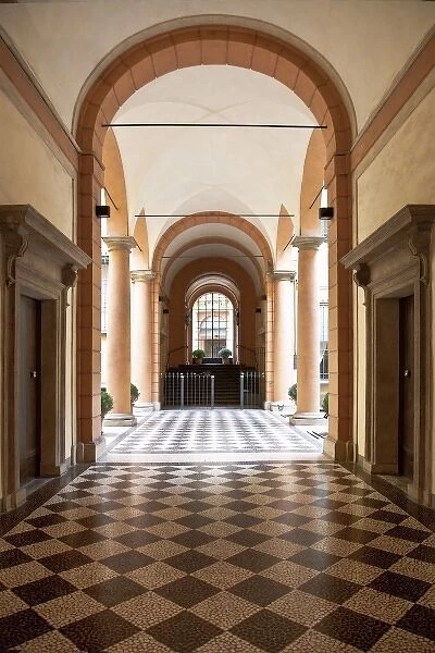 Bologna, Emilia-Romagna, Italy - An arched hallway with a diamond patterned floor