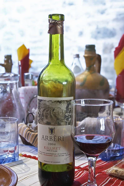 Bottle of Arberi 2004 Kallmet Vere e Kuqe, Eurogers Winery, Mirdite, and glass of red wine