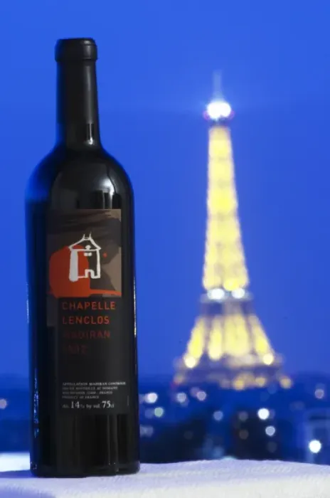 Framed Print : Bottle of Chapelle Lenclos against a dark blue sky background view over Paris with Framed Print : Bottle of Chapelle Lenclos against a dark blue sky background view over Paris with