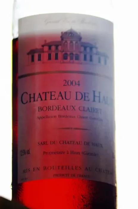 Framed Print : A bottle of Chateau de Haux rose clairet wine backlit Chateau de Haux Premieres