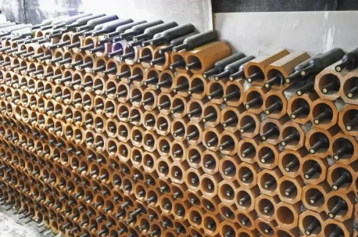Framed Print : Bottles stored laying down piled high in terracotta earthenware tube containers Framed Print : Bottles stored laying down piled high in terracotta earthenware tube containers