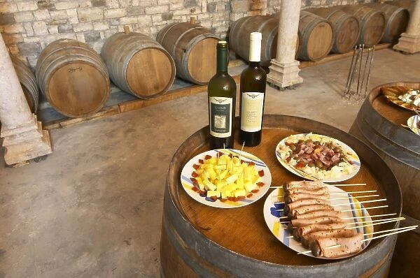 Bottles of wine and Albanian appetizers: cheese olives sausage... Cobo winery, Poshnje, Berat