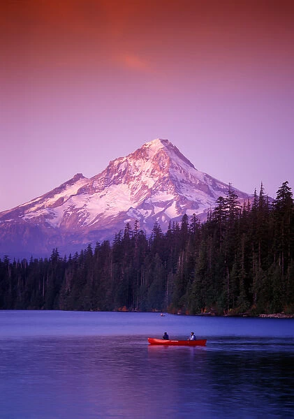Two boys in canoe just after sunset at Lost Lake with Mt. Hood in the background