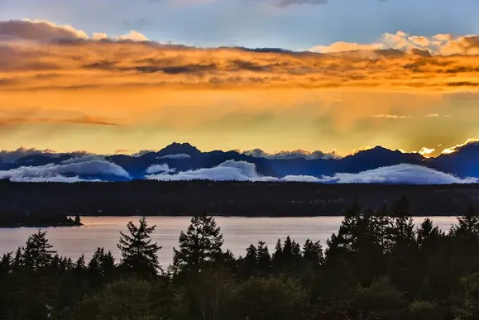 Framed Print : Bremerton, Washington. The Olympic Mountains, featuring Brothers Mountain, bask in a golden Framed Print : Bremerton, Washington. The Olympic Mountains, featuring Brothers Mountain, bask in a golden