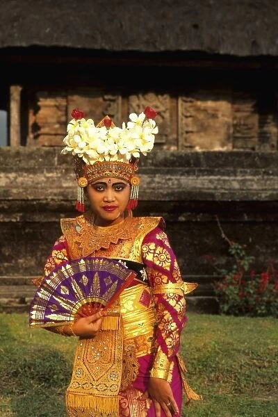 Bride in full traditional dress in beautiful religious temple in Bali Indonesia Lake