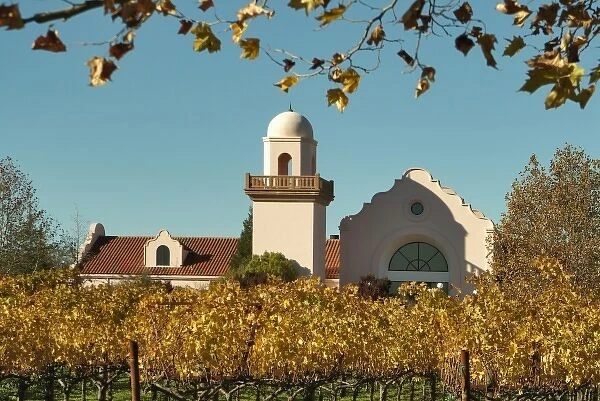 Bright reds and yellows of fall-colored leaves in front of Groth Vineyards & Winery