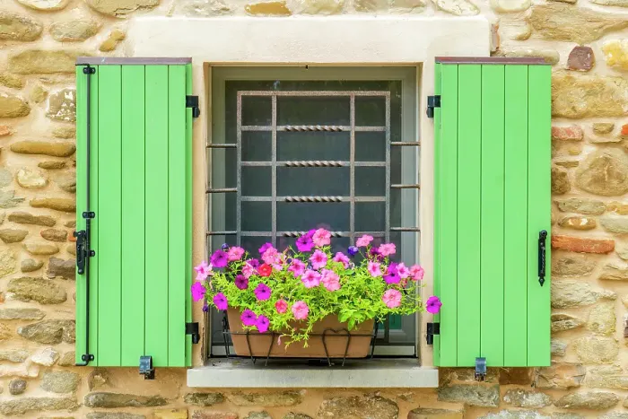 Framed Print : Brisighella, Emilia Romagna, Italy. Portrait of a colorful flower basket in a shuttered window of an old stone house