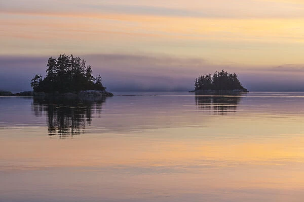 British Columbia. Sunset paints a canvas of pastel hues in Johnstone Strait