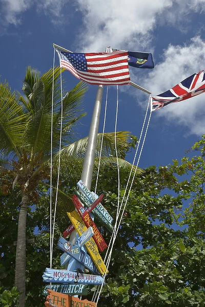 British Virgin Islands, Marina Cay. Colorful flags and direction signs