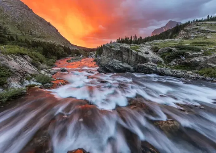Framed Print : Brlliant sunrise sky over Swiftcurrent Falls in Glacier National Park, Montana, USA