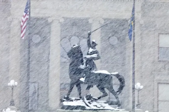 Framed Print : Bronze statue of Thomas Meagher in heavy snowfall in front of Montana State Capitol
