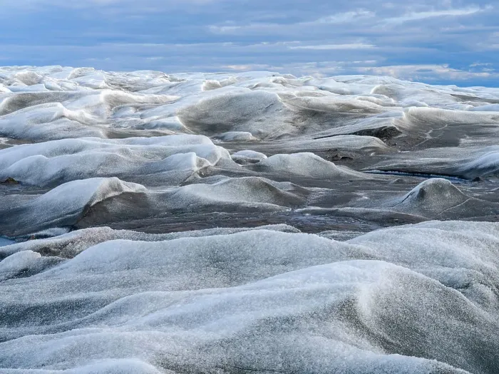 Framed Print : The brown sediment on the Greenland ice is created by the rapid melting of the ice. Landscape of Greenland near Kangerlussuaq, Kingdom of Denmark