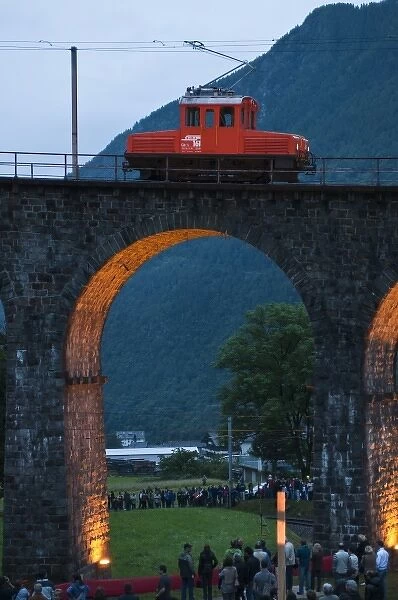 Brusio, Switzerland. Historic rail cars and trains on the circular railway viaduct in Brusio