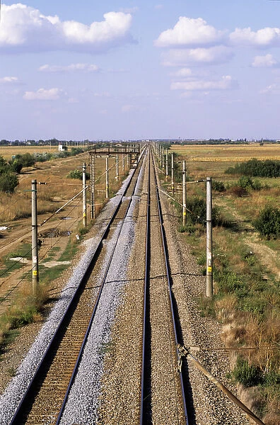 Bucharest, Romania. Electrified railway line with fresh laid ballast stretching into