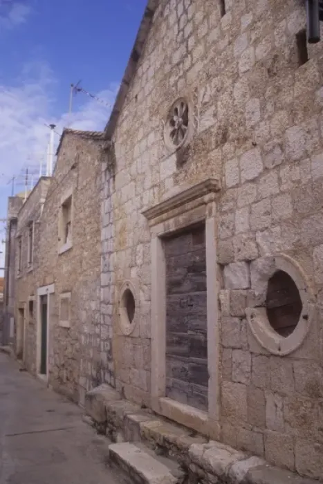 Framed Print : Building entryway and door detail along a narrow street. Vis town. Vis Island. Croatia