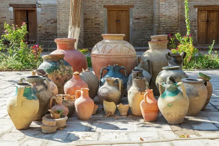 Framed Print : Bukhara, Uzbekistan, Central Asia. Variety of pots in a courtyard in Bukhara