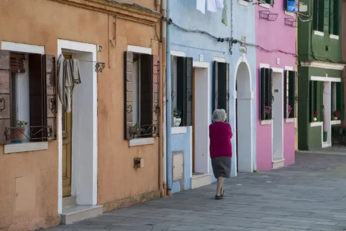 Framed Print : Burano and colorful buildings with elderly lady taking a walk Framed Print : Burano and colorful buildings with elderly lady taking a walk