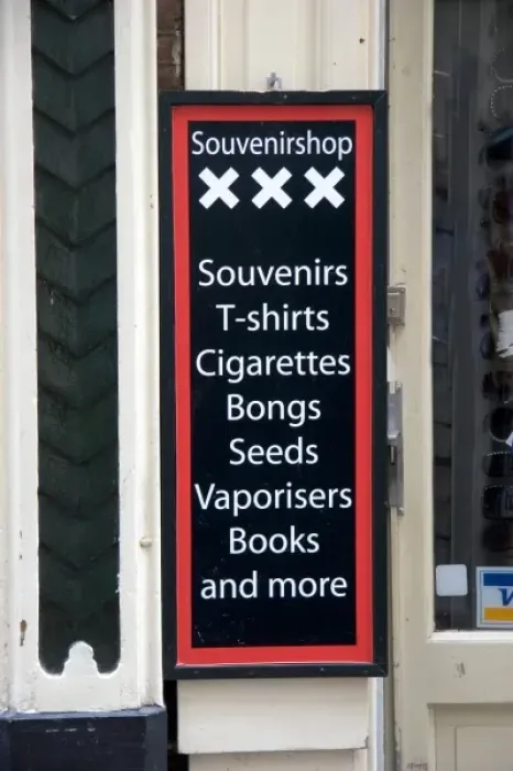 Framed Print : A business sign advertising the sale of marijuana accessories in Amsterdam, Netherlands
