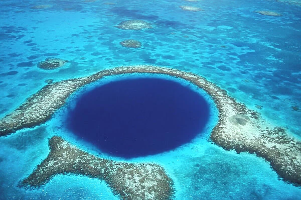CA, Belize. Aerial view of Blue Hole (diameter 1000 ft. ) at Lighthouse reef
