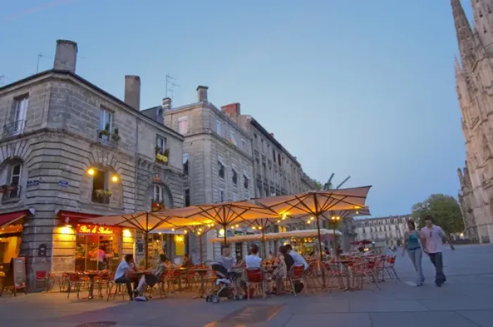 Framed Print : A cafe on the place pey berland in Bordeaux, outside seating terrasse lit by electric lights