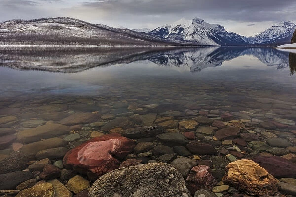 Calm reflection on the first day of spring on Lake McDonald in Glacier National Park