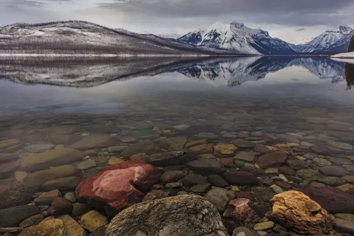 Framed Print : Calm reflection on the first day of spring on Lake McDonald in Glacier National Park
