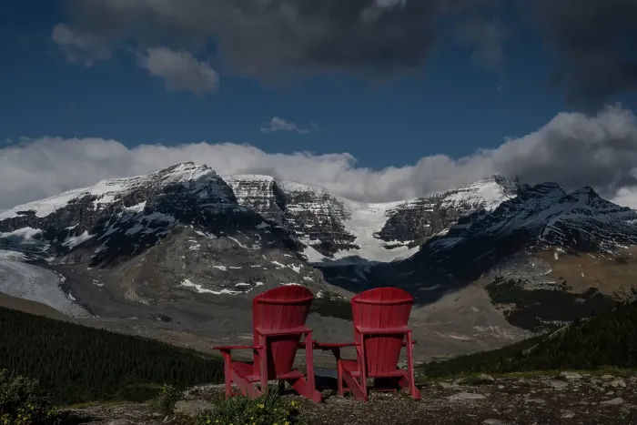 Framed Print : Canada, Alberta. Athabasca Glacier and lounge chairs looking across Icefields Parkway, Jasper National Park