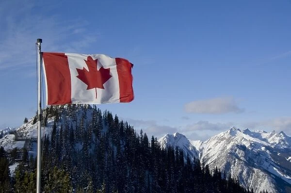 Canada, Alberta, Banff. Mountain views with Canadian flag on the summit of Sulphur Mountain