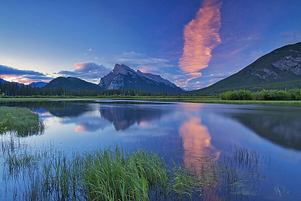 Canada, Alberta, Banff National Park. Cloud reflected in lake at sunrise