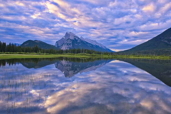 Canada, Alberta, Banff National Park. Reflections in lake at sunrise