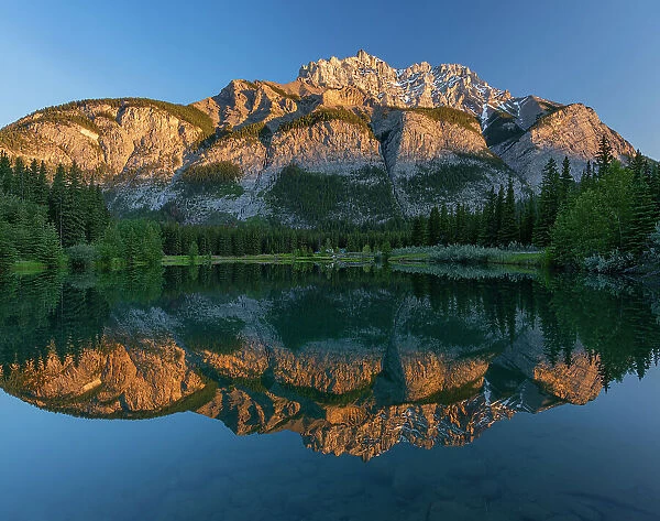 Canada, Alberta, Banff National Park. Cascade Mountain reflected in Cascade Pond at sunrise